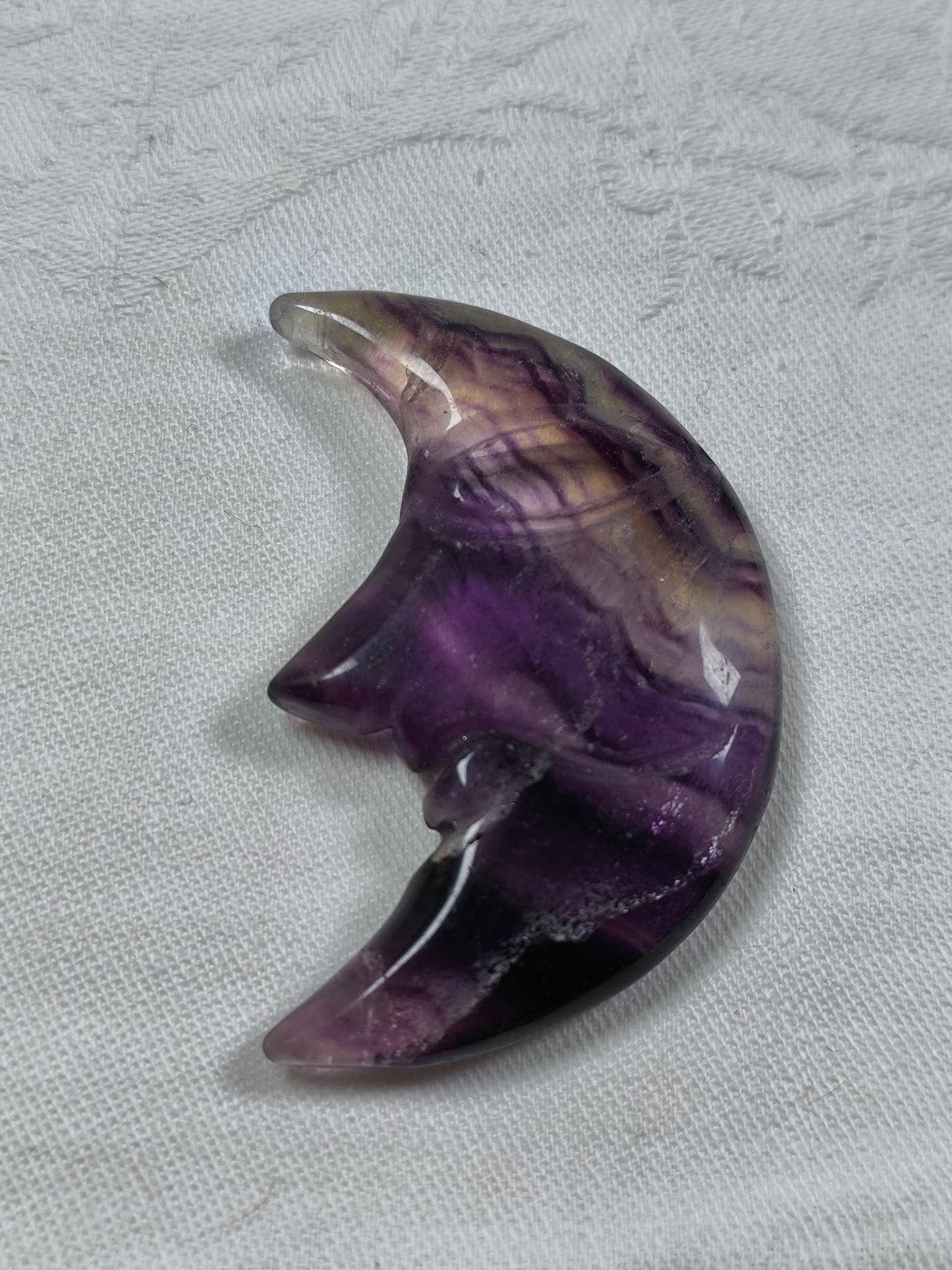 Rainbow fluorite moon face carvings