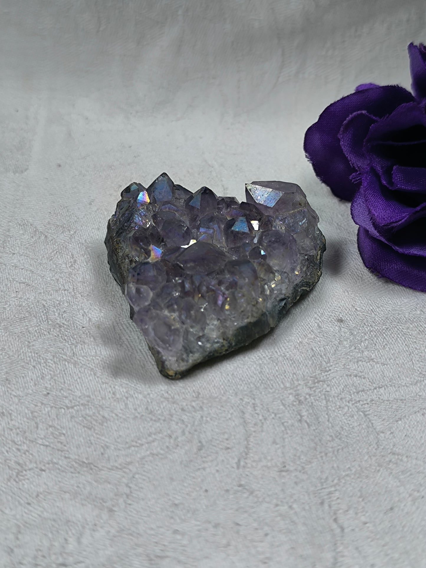 Small aura coated raw amethyst piece