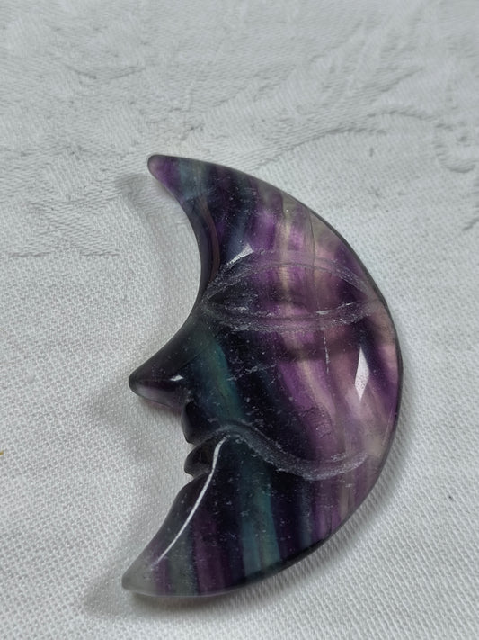 Rainbow fluorite moon face carvings