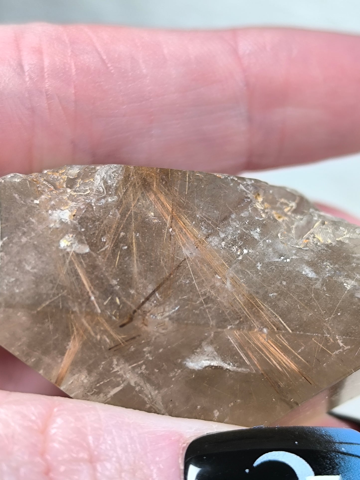 Part polished smoky quartz with rutile