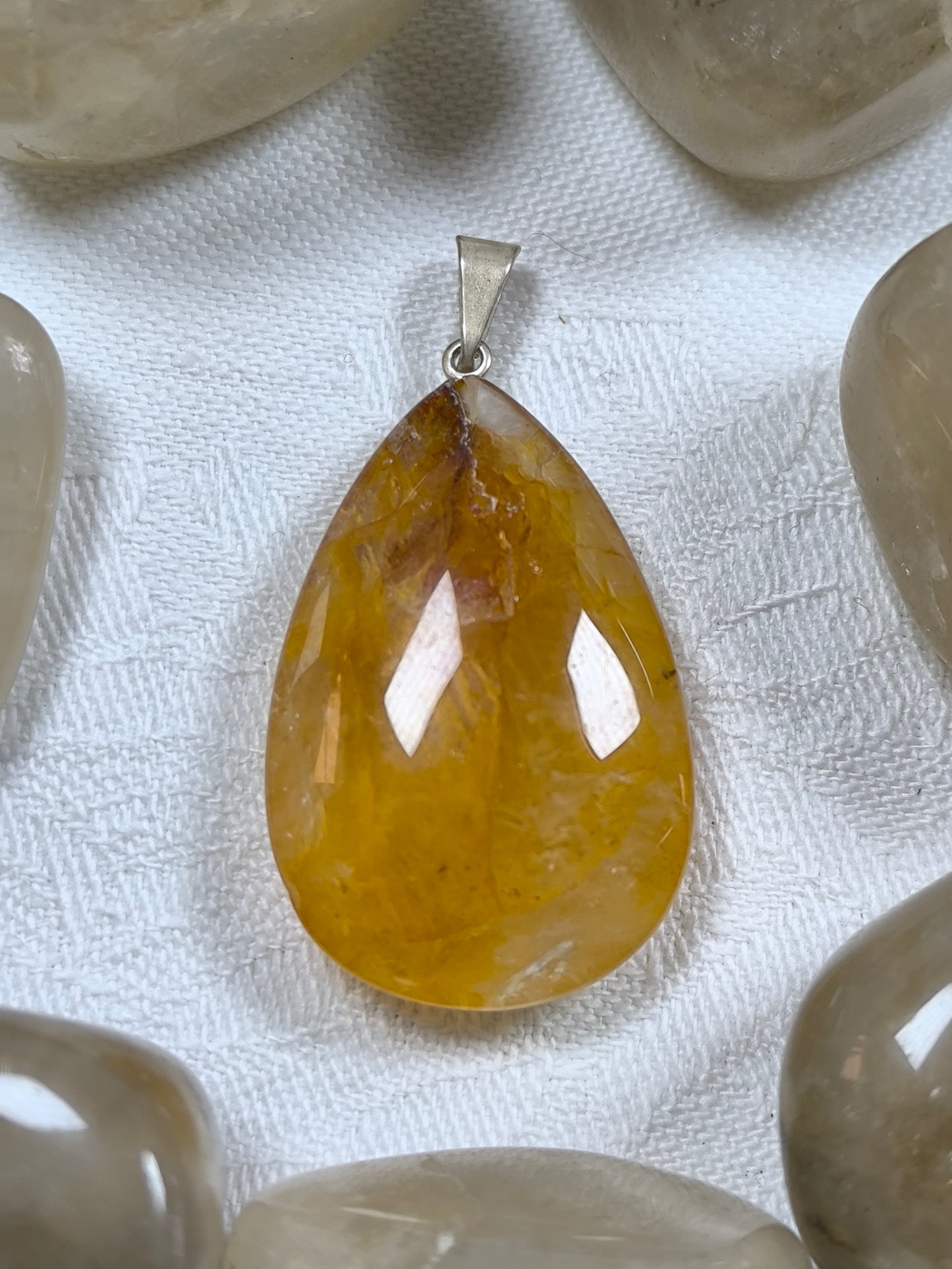 Golden healer teardrop pendant