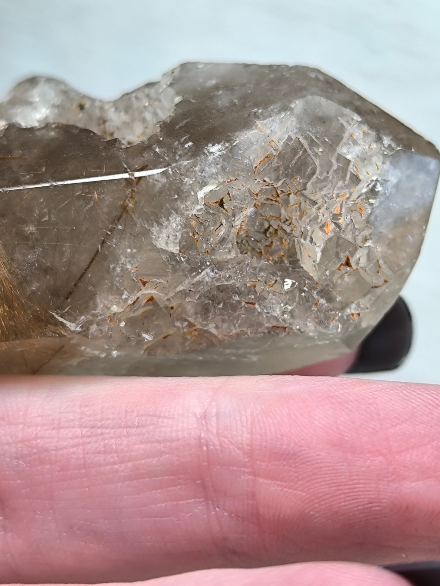 Part polished smoky quartz with rutile