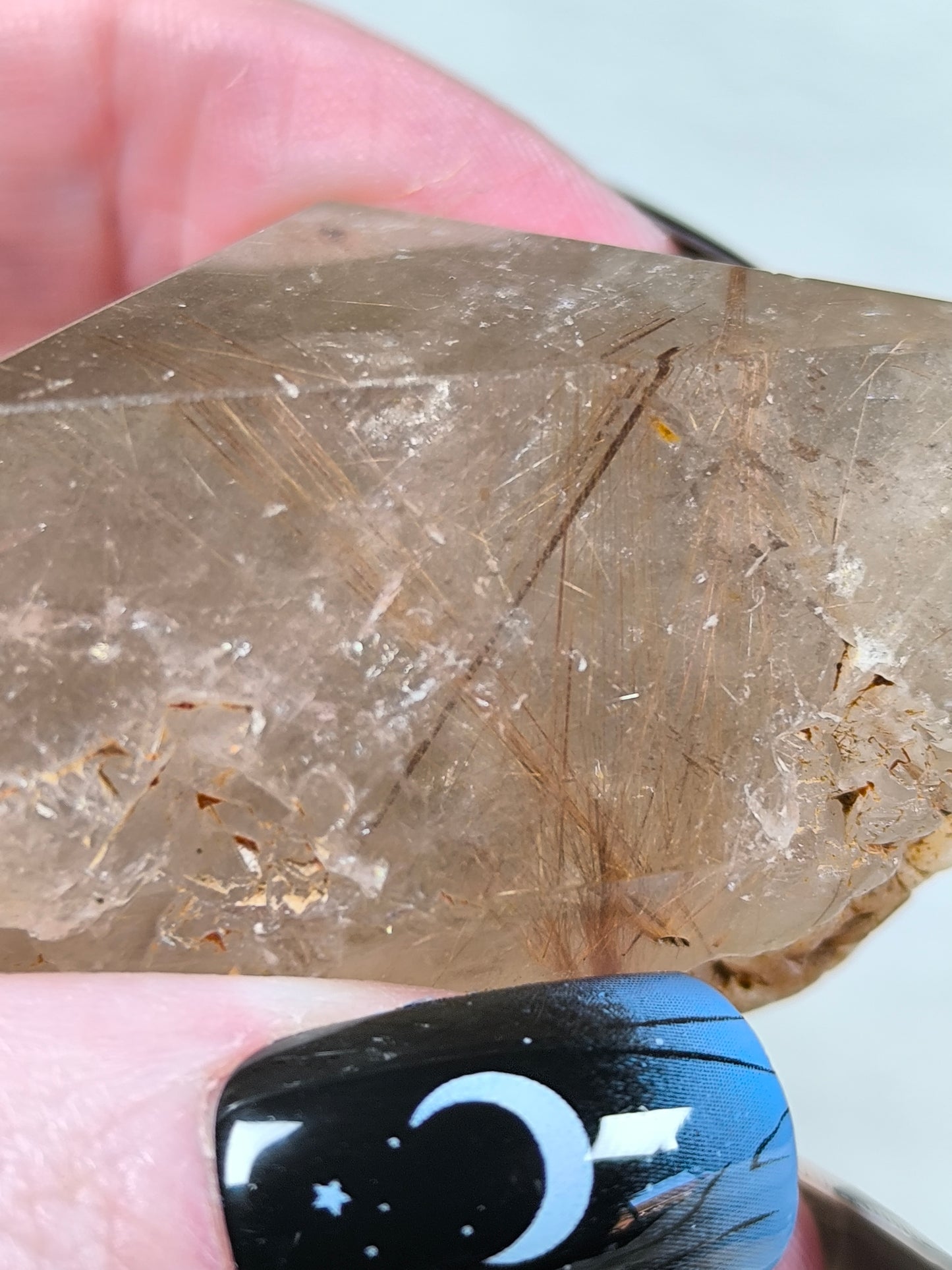 Part polished smoky quartz with rutile