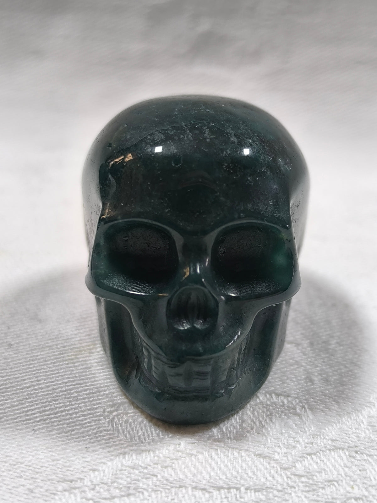 Moss agate skulls