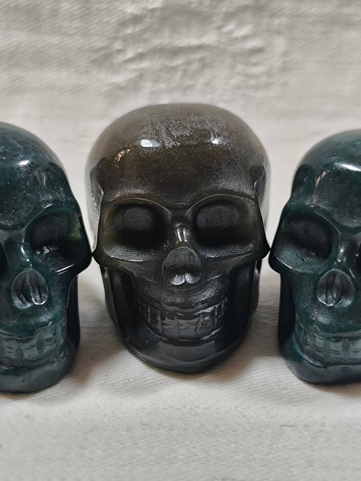 Moss agate skulls