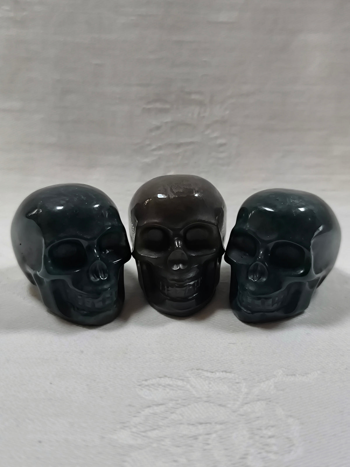 Moss agate skulls