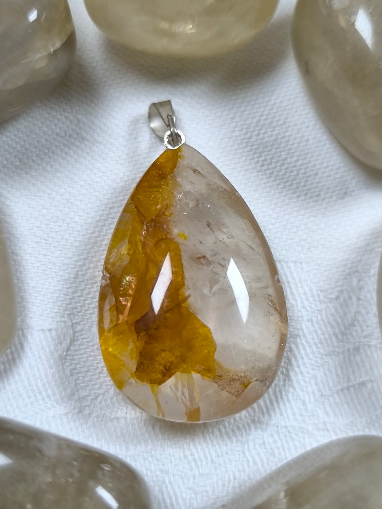 Golden healer teardrop pendant