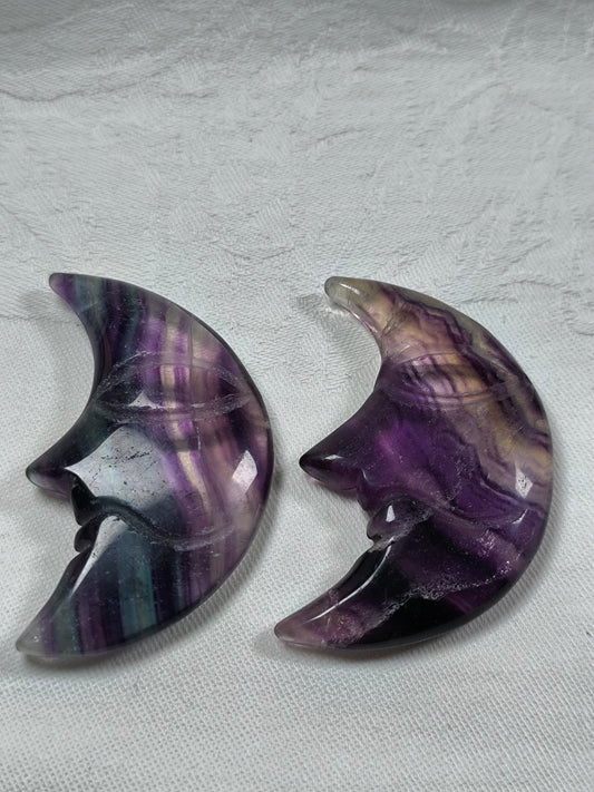 Rainbow fluorite moon face carvings