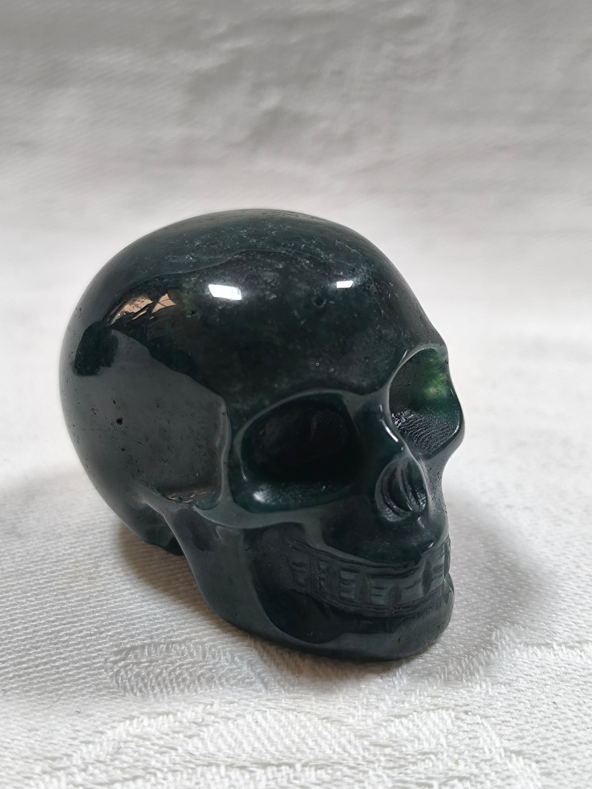 Moss agate skulls