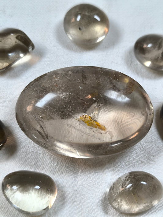 Smoky quartz palm stone with golden healer